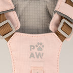 Close-up of the PAW logo on the pink harness
