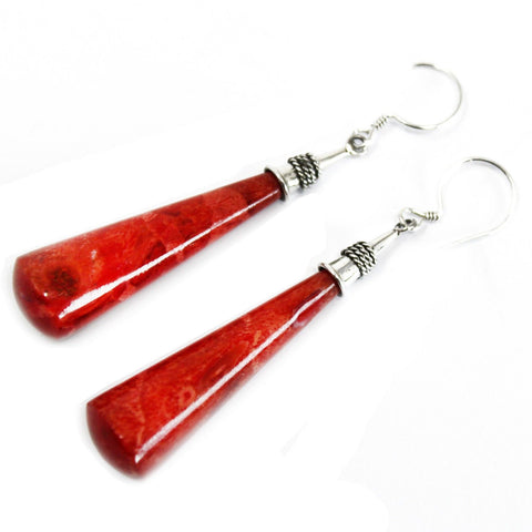 Long red teardrop earrings with silver hooks, shown together on a white background