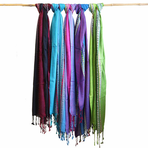 Five folded Indian boho scarves in different colourways hanging from a rail, showing the range's variety, not one exact scarf