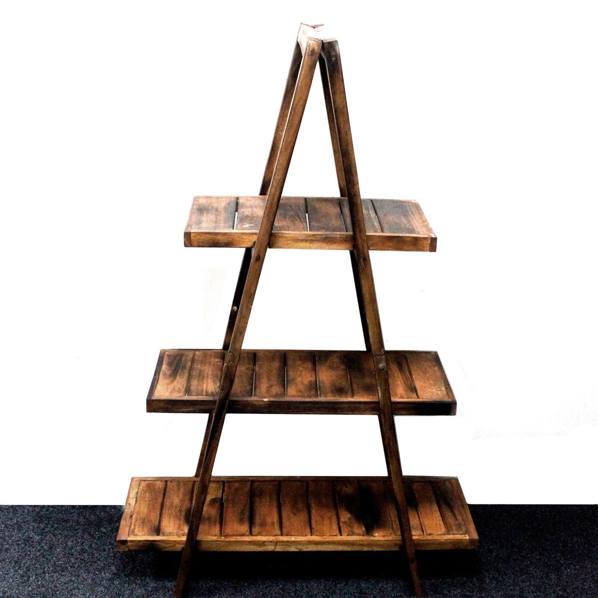 Folding Wooden A-Frame Shelf, brown three-tier wooden shelving shown alone against a white wall