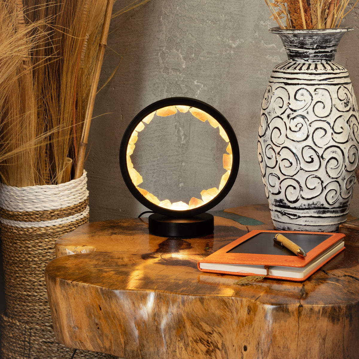 Glowing rose quartz halo lamp on a table