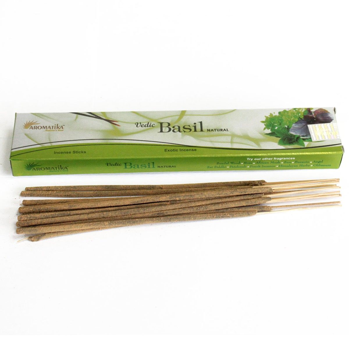 Basil incense sticks in a long green box, shown horizontally with loose sticks on a white background