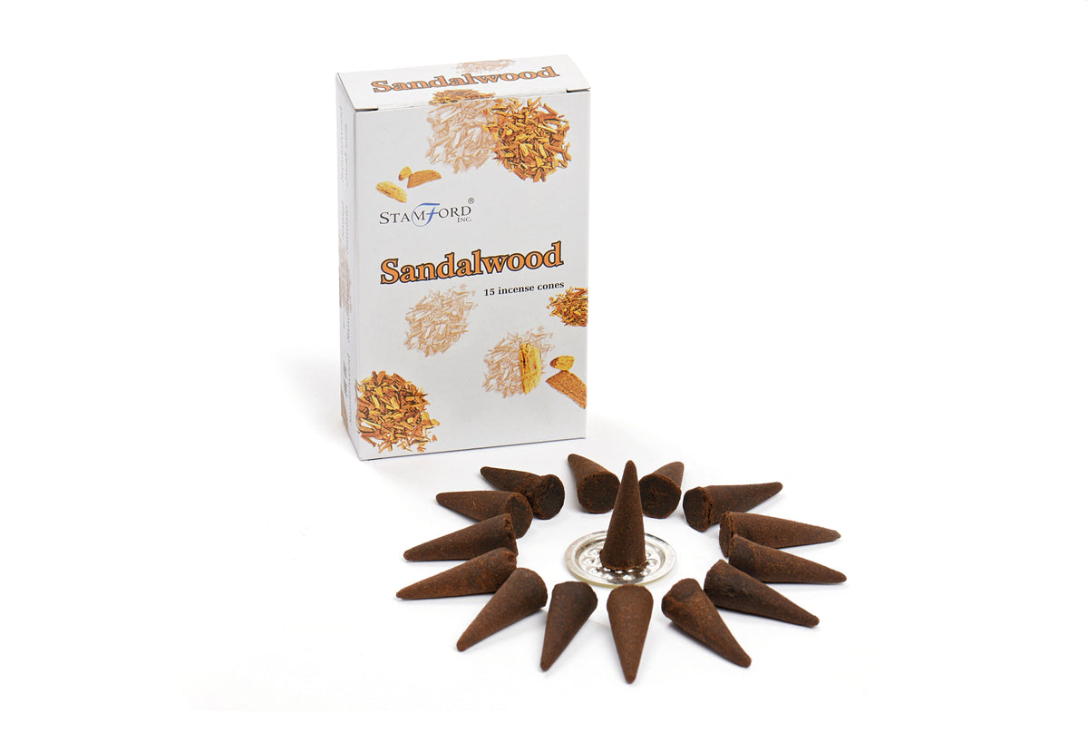Sandalwood Cones in a printed box beside dark brown cones arranged around a small holder