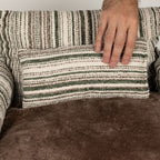 Close view of the striped back cushion and brown plush seat
