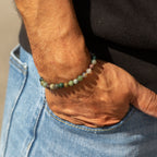 Moss Agate bracelet worn with a dark top and jeans