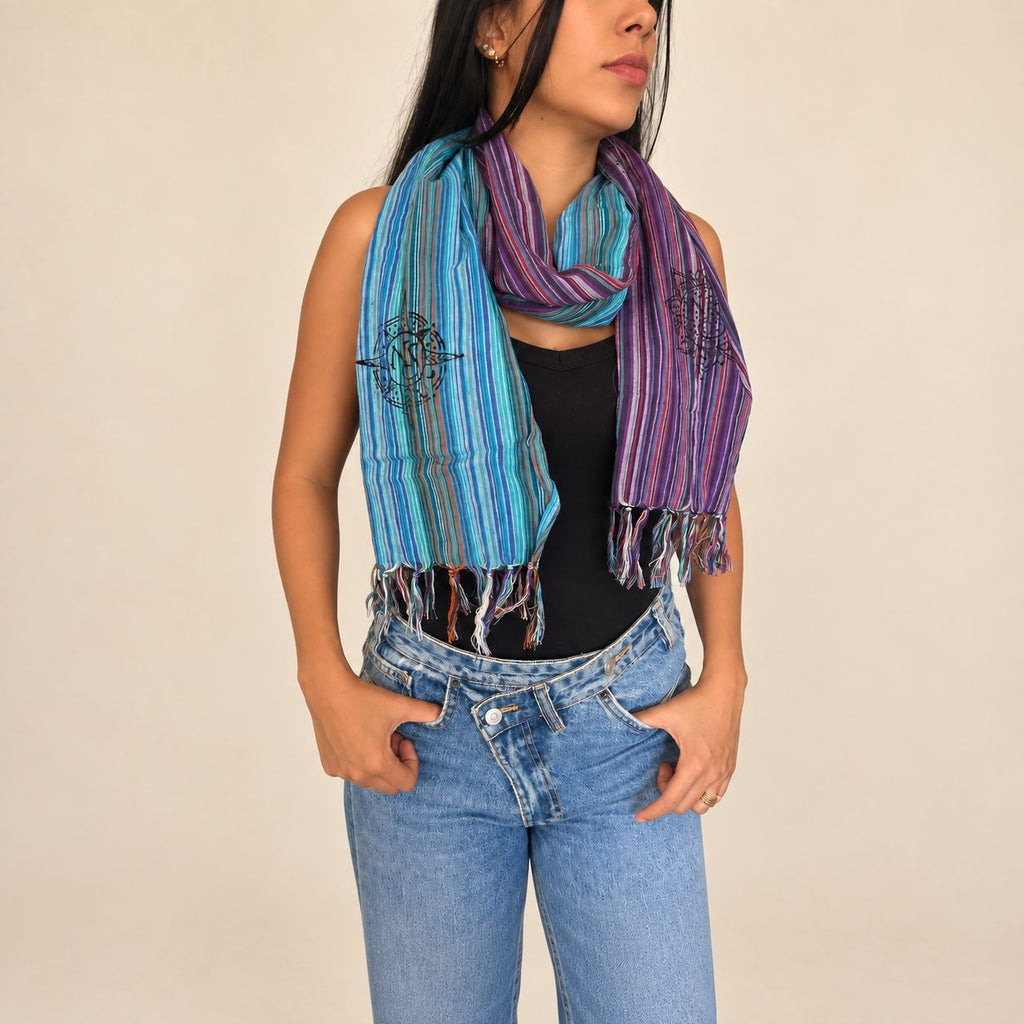 Model wearing the striped scarf around her neck