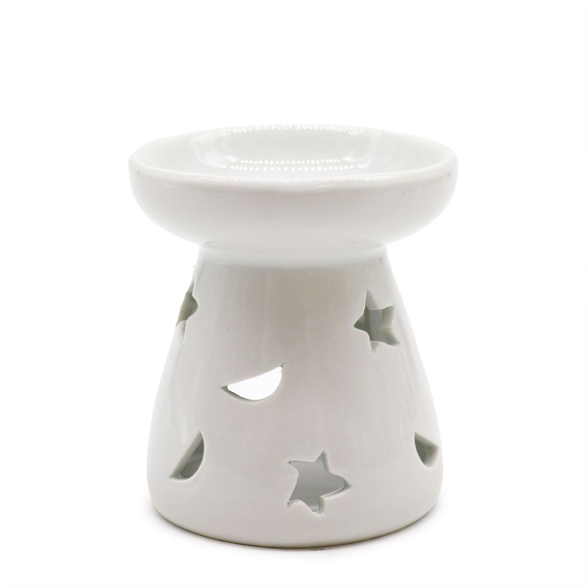 White ceramic oil burner with star, moon and teardrop cut-outs, unlit