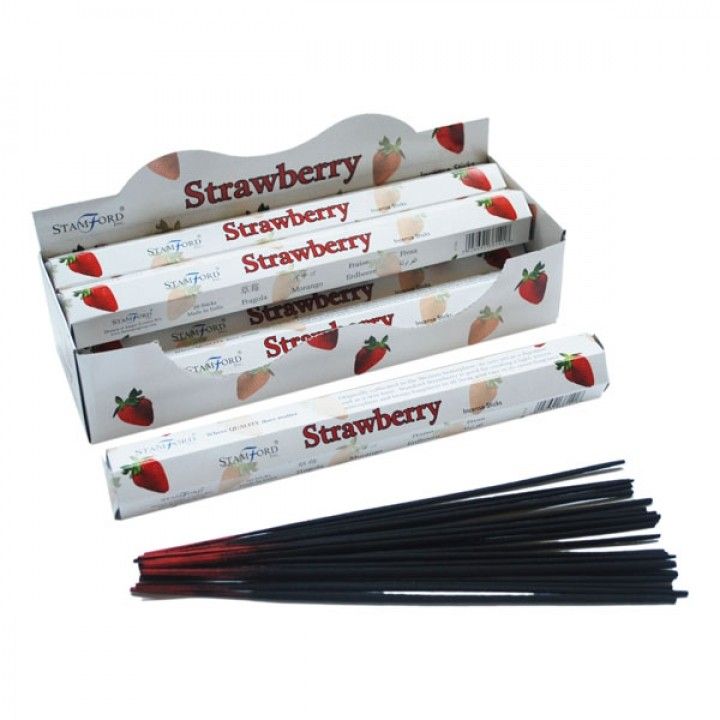 Strawberry Premium Incense in white Stamford boxes, with several black incense sticks laid out in front