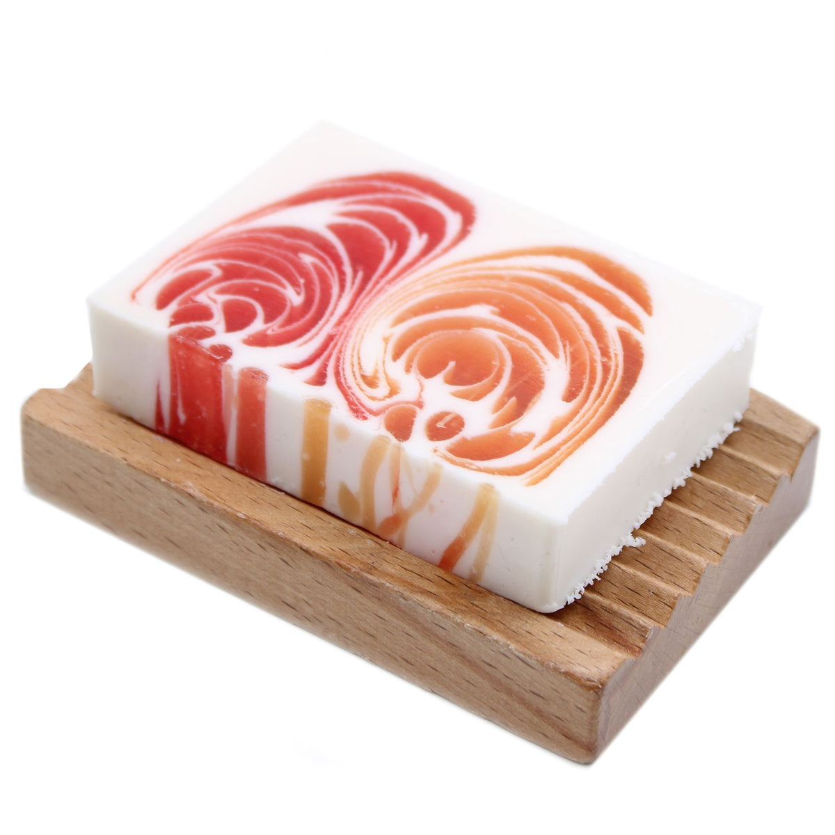 Handcrafted Soap 100g Slice, Grapefruit, white soap with red and orange swirls on a wooden dish