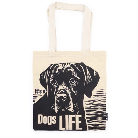 Dog's Life tote bag shown from the front, with black dog print and text on natural fabric
