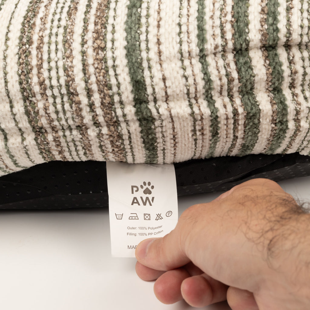 Care label beneath the striped pet bed