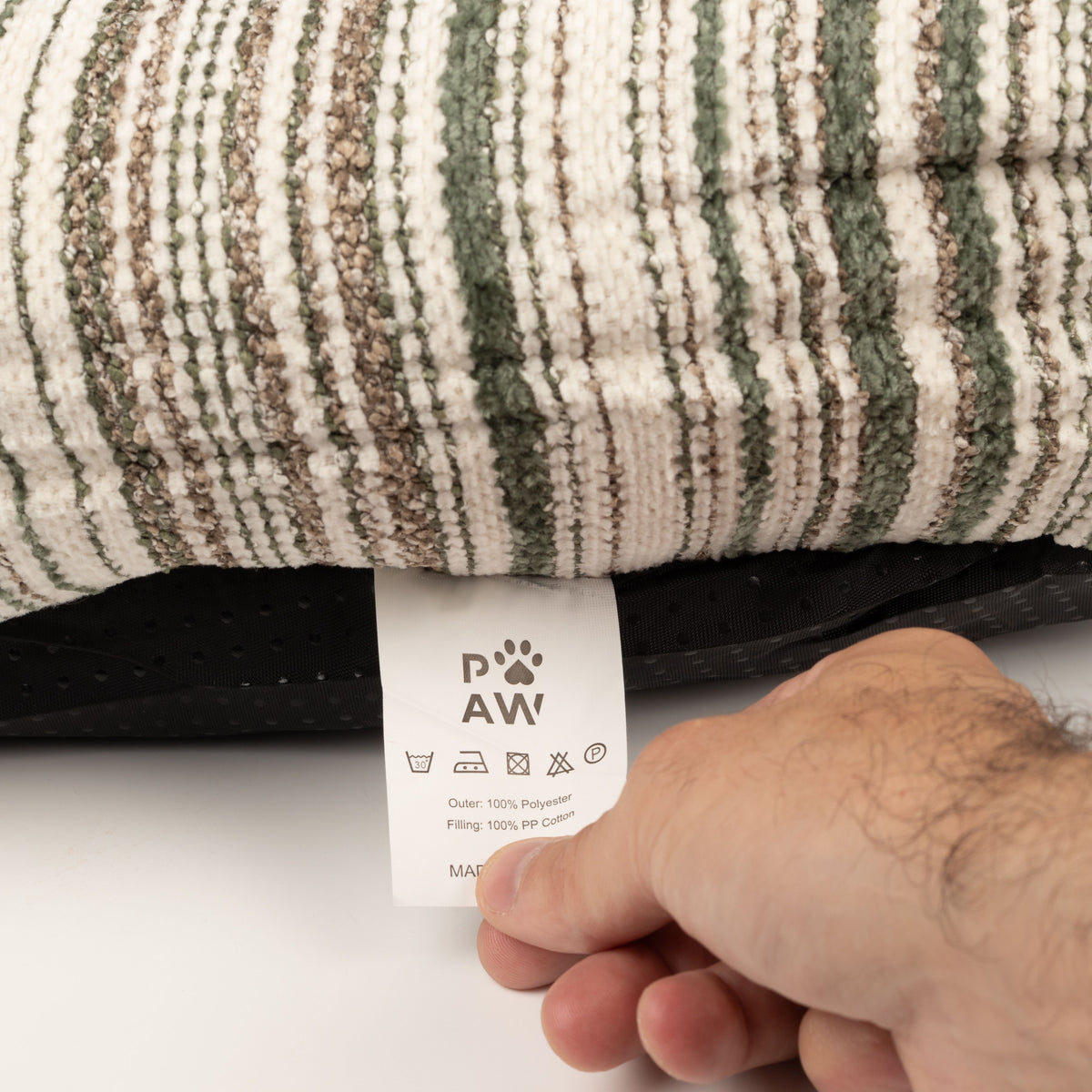 Care label beneath the striped pet bed