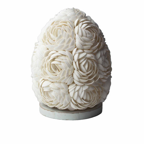 Boho Sea Shell Lamp, Rose Oval, 15cm, shown upright on a pale round base against a white background
