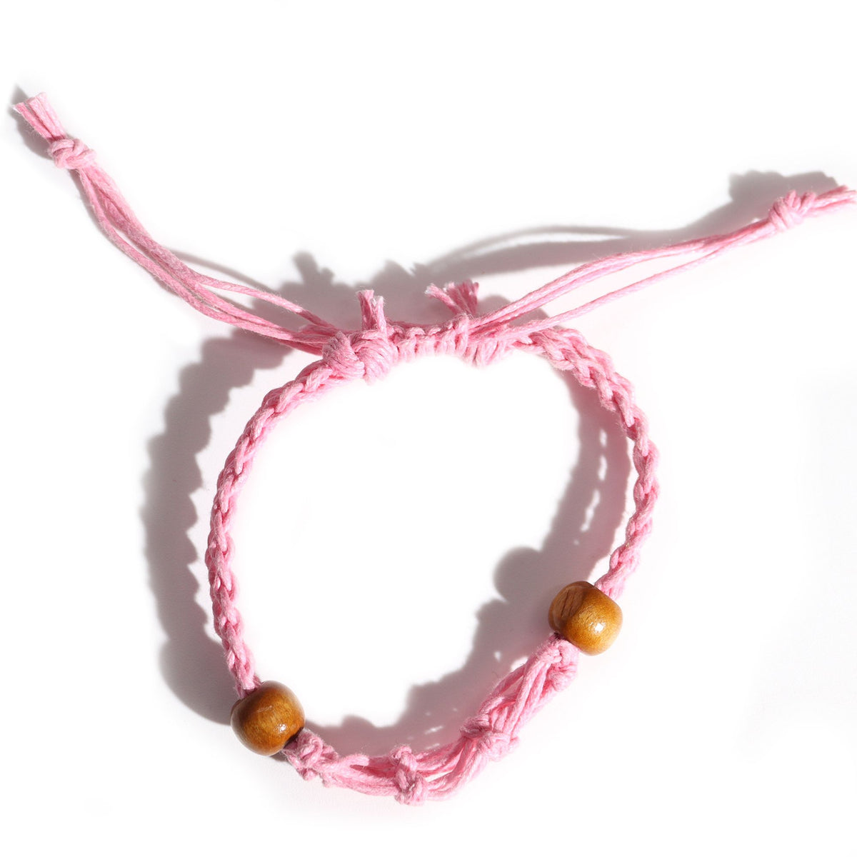 Gemstone Bracelet Cord, Pink, braided pink cord with two brown beads, overhead view on white
