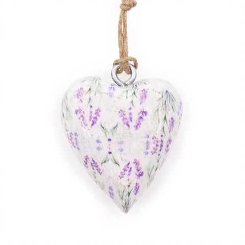 Lavender wood heart ornament hanging by a twine loop, close-up showing its purple floral pattern