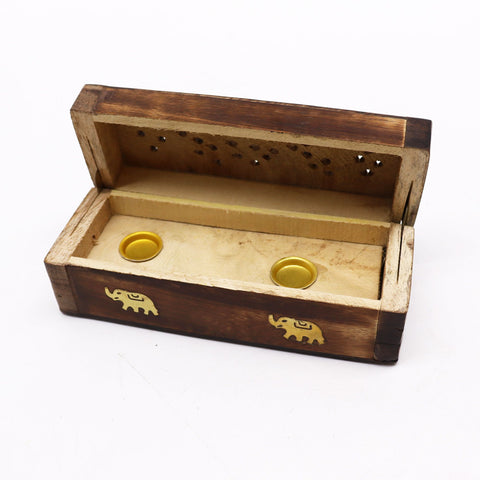 Open mango wood incense box with two gold cone holders and pierced holes in the raised lid