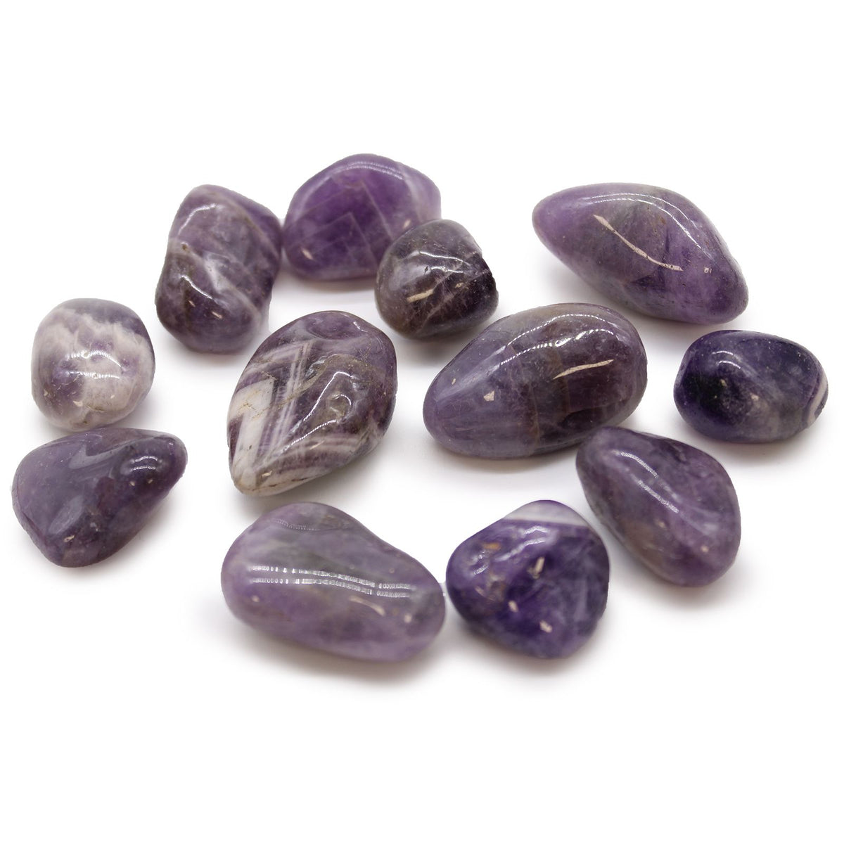 Medium African Tumble Stones, Amethyst, a group of polished purple stones on a white background