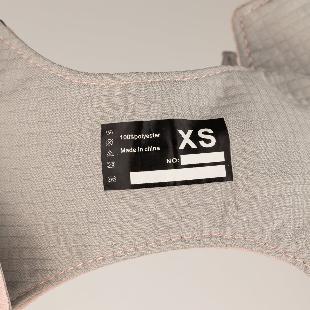 Close-up of the harness label and grey inner lining