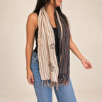 Nomad Sari Nomad Compass scarf worn around the neck