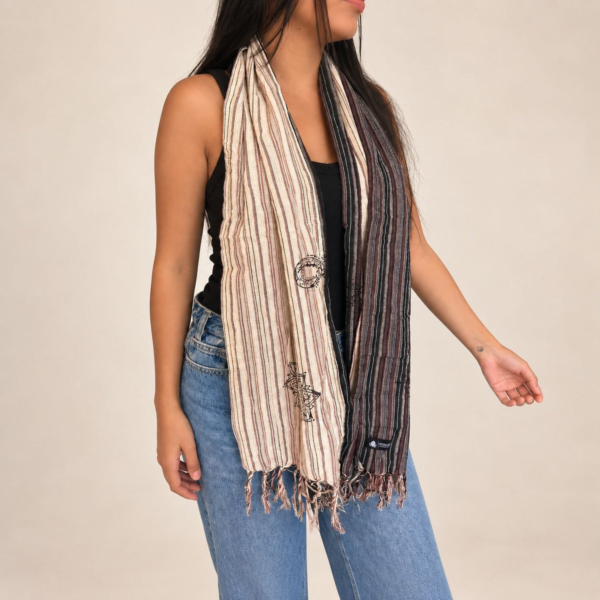 Nomad Sari Nomad Compass scarf worn around the neck
