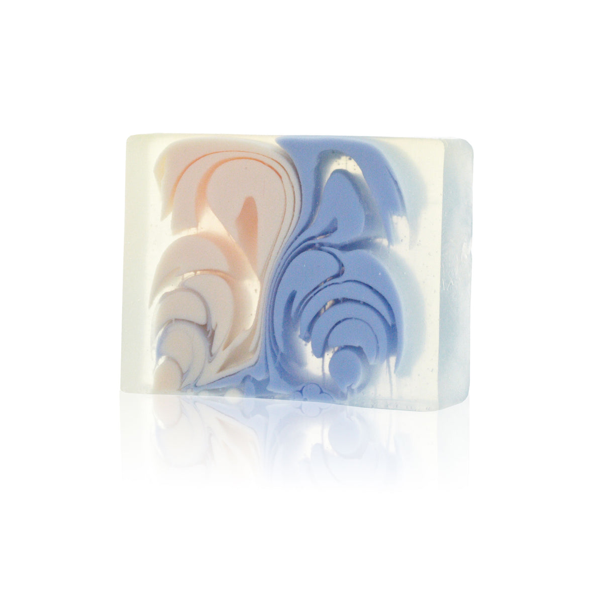 Pharaoh soap slice close-up, showing cream, blue and peach swirls on its front face