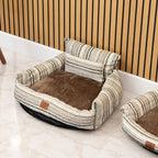 Striped sofa bed shown beside another bed