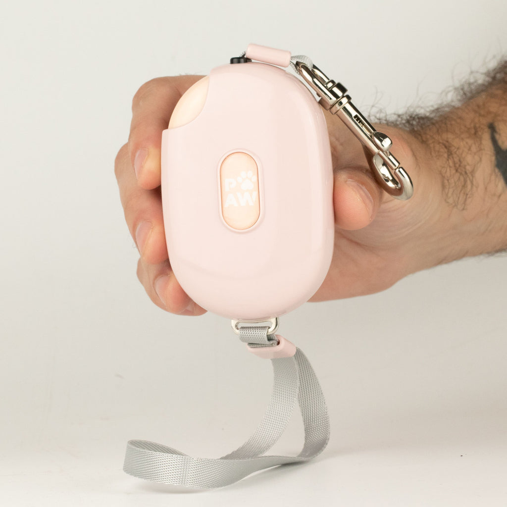 Close view of the pink lead casing, wrist strap and metal clip
