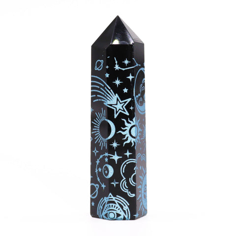 Black Obsidian Point standing upright, showing sky blue stars, suns and a shooting star