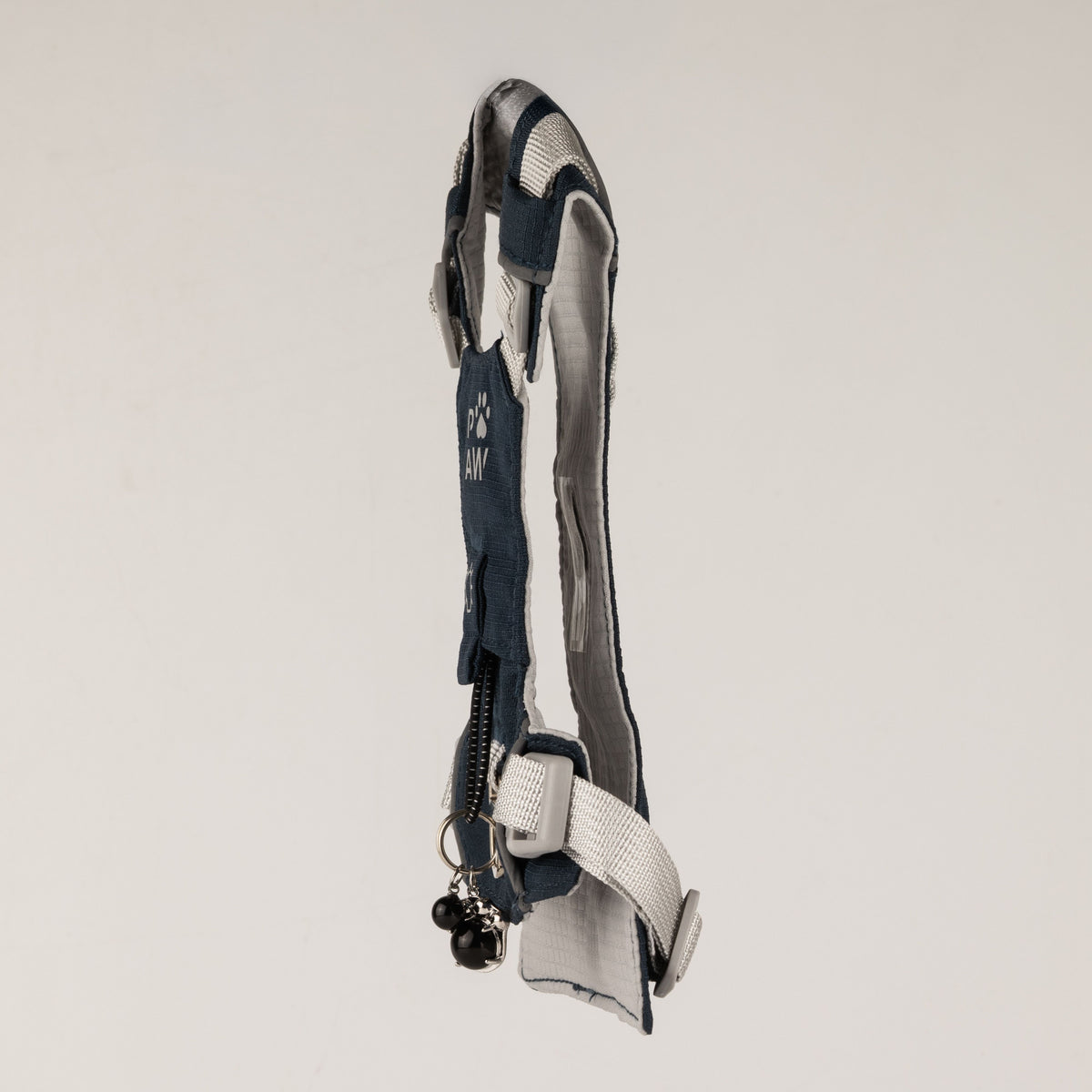 Side view showing the harness profile and charm