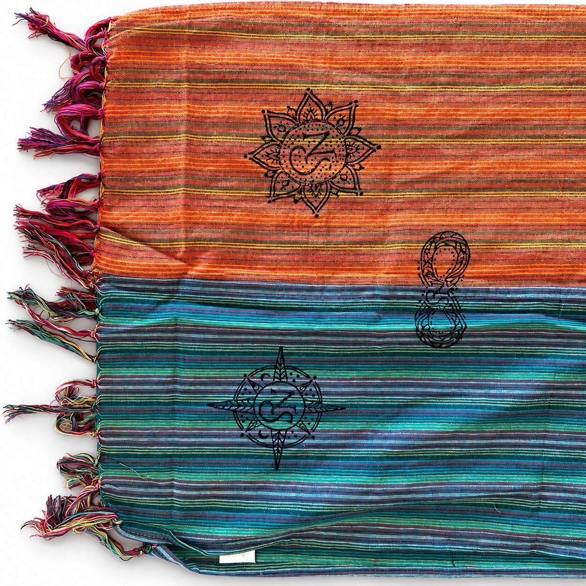 Scarf laid flat showing contrasting colour sections and printed symbols